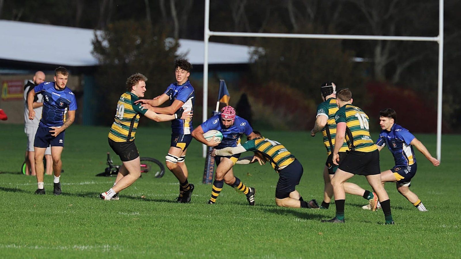 Martial, in blue, carrying the ball into a tackle for Eastbourne RFC